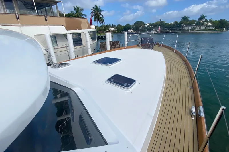 Slide: The Image of 1994 Lyman-Morse Cruising Yacht deck with scenic waterfront view. - 14