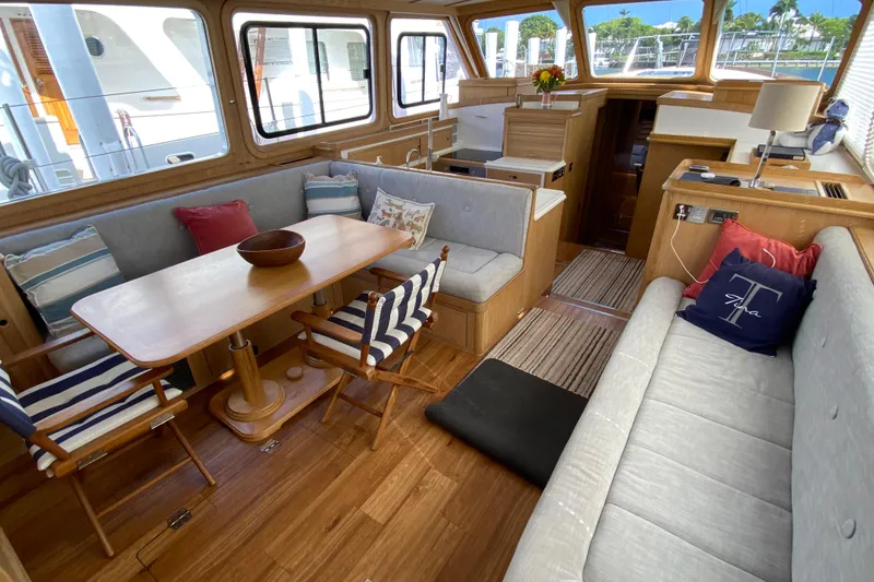 Slide: The Image of Luxurious 1994 Lyman-Morse cruising yacht interior with elegant wood finishes and comfortable seating. - 2