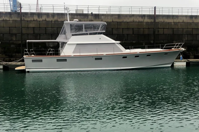Slide: The Image of 1994 Lyman-Morse Cruising Yacht docked in calm waters, side view. - 21