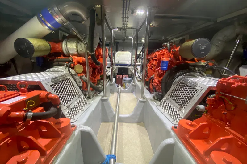 Slide: The Image of Engine room of a 1994 Lyman-Morse Cruising Yacht with red machinery and metal components. - 22
