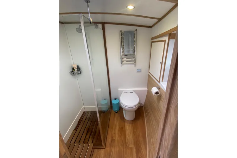 Slide: The Image of Bathroom interior of 1994 Lyman-Morse Cruising Yacht with shower and wooden flooring. - 7