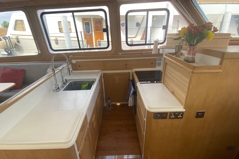 Slide: The Image of Interior of 1994 Lyman-Morse Cruising Yacht with modern kitchen and large windows. - 9