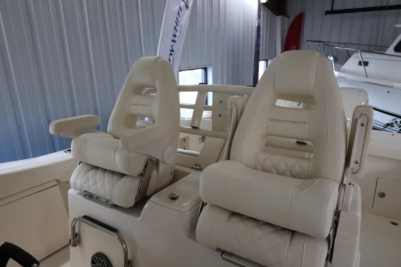 Slide: The Image of 2026 Grady-White Canyon 306 boat seats, luxurious white leather interior. - 9