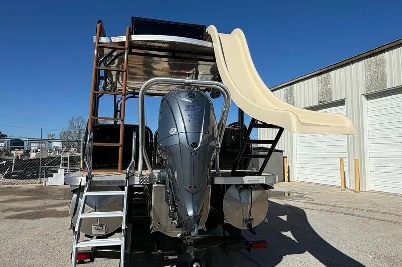 Slide: The Image of 2026 Aloha Paradise 300 Sundeck with slide and ladder, parked outdoors. - 14