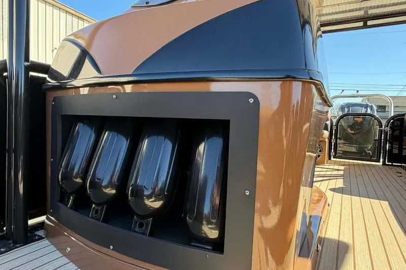 Slide: The Image of 2026 Aloha Paradise 300 Sundeck, sleek design with modern features, docked outdoors. - 21