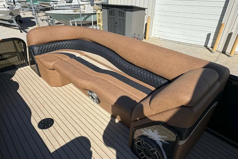 Slide: The Image of Luxurious seating on 2026 Aloha Paradise 300 Sundeck boat, featuring elegant brown and black upholstery. - 29