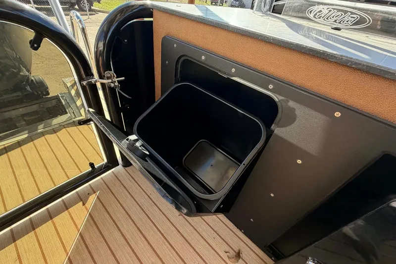 Slide: The Image of Open storage compartment on 2026 Aloha Paradise 300 Sundeck boat deck. - 8