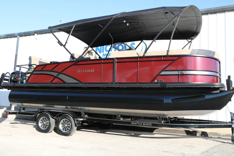 The Image of 2026 Sylvan L3 RLZ pontoon boat with red exterior on a trailer. - 1