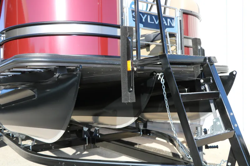 Slide: The Image of 2026 Sylvan L3 RLZ pontoon boat with sleek red exterior and sturdy black ladder. - 10