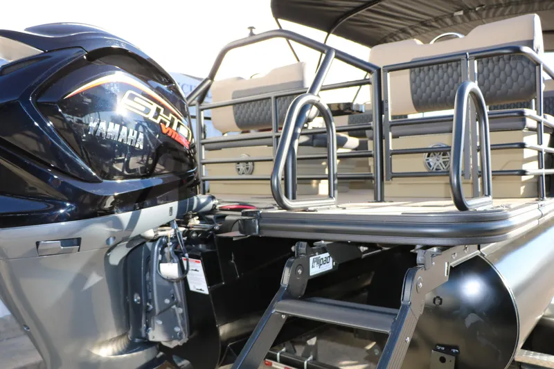 Slide: The Image of 2026 Sylvan L3 RLZ pontoon boat with Yamaha engine, rear view. - 13
