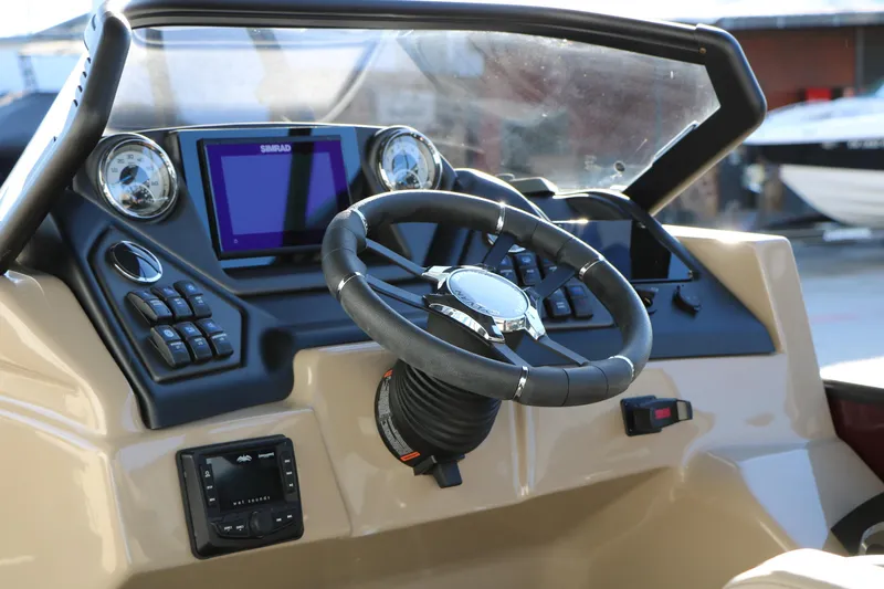 Slide: The Image of 2026 Sylvan L3 RLZ boat dashboard with steering wheel and control panel. - 33