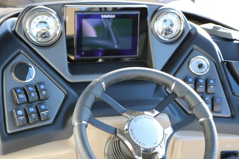 Slide: The Image of Steering console of 2026 Sylvan L3 RLZ boat with modern controls and display. - 35