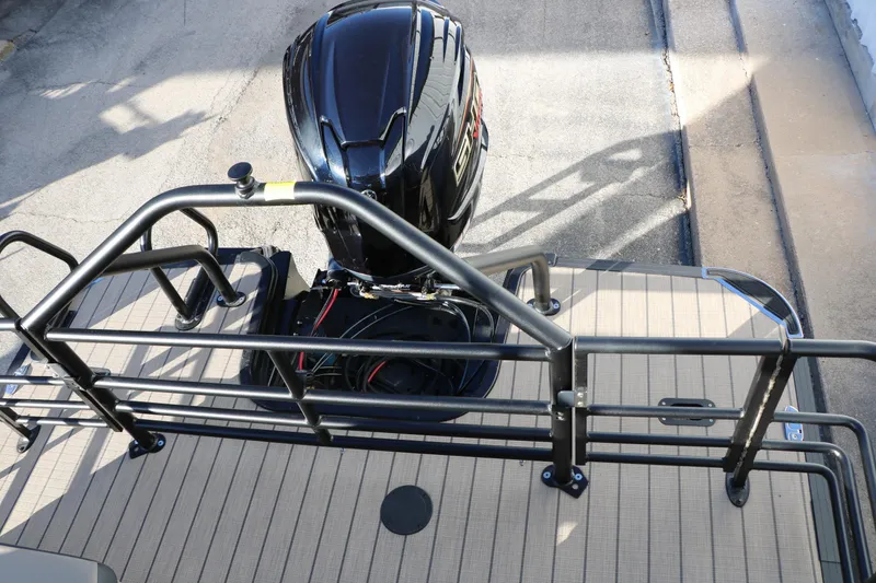 Slide: The Image of 2026 Sylvan L3 RLZ boat with sleek black engine and sturdy railing. - 36