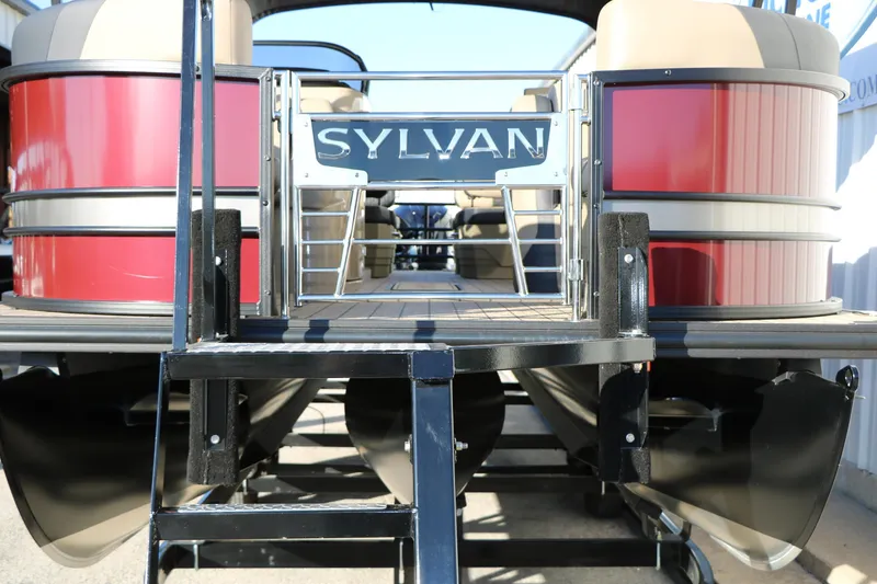 Slide: The Image of 2026 Sylvan L3 RLZ pontoon boat with red exterior and spacious deck. - 4