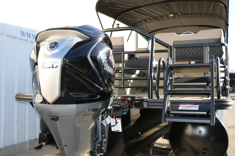 Slide: The Image of 2026 Sylvan L3 RLZ pontoon boat with powerful outboard motor and sleek design. - 6