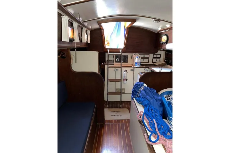 Slide: The Image of Interior of 1981 Cape Dory 33 sailboat with wood finish and nautical equipment. - 6