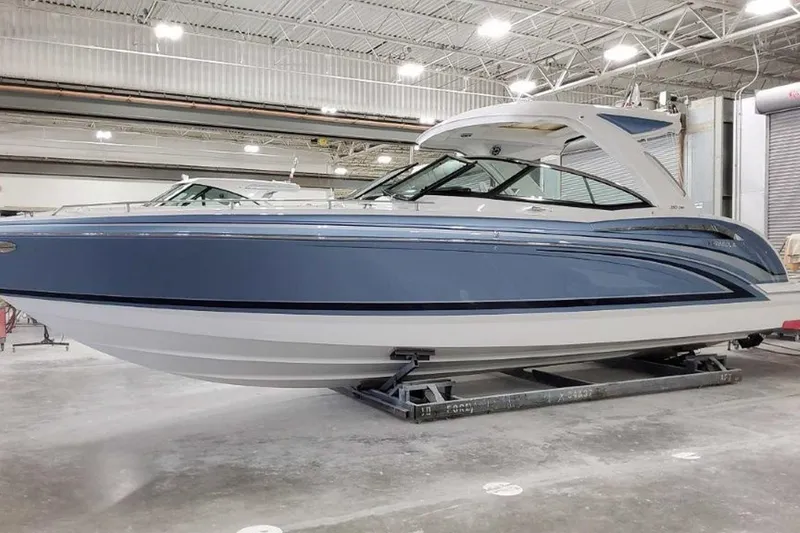 The Image of 2023 Formula 350 Crossover Bowrider I/O in a showroom, showcasing sleek design and modern features. - 0