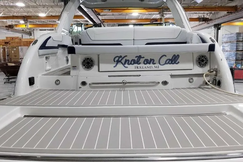 Slide: The Image of 2023 Formula 350 Crossover Bowrider I/O boat with "Knot on Call" name, docked indoors. - 11