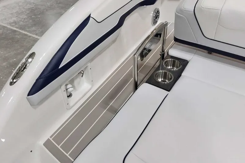 Slide: The Image of 2023 Formula 350 Crossover Bowrider I/O interior with cup holders and sleek seating design. - 13