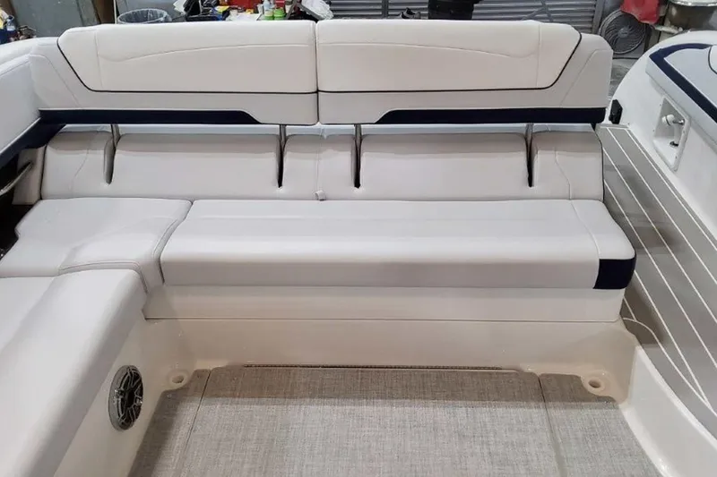 Slide: The Image of 2023 Formula 350 Crossover Bowrider I/O interior seating, featuring sleek white upholstery. - 15