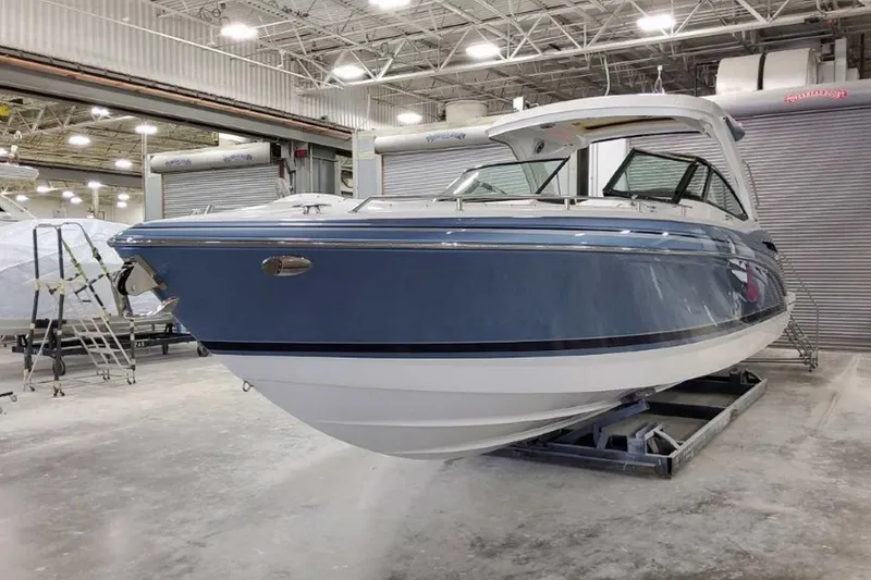 Slide: The Image of 2023 Formula 350 Crossover Bowrider I/O in a showroom, showcasing sleek design and modern features. - 2