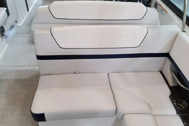 Slide: The Image of 2023 Formula 350 Crossover Bowrider I/O interior seating, featuring white upholstery and sleek design. - 23