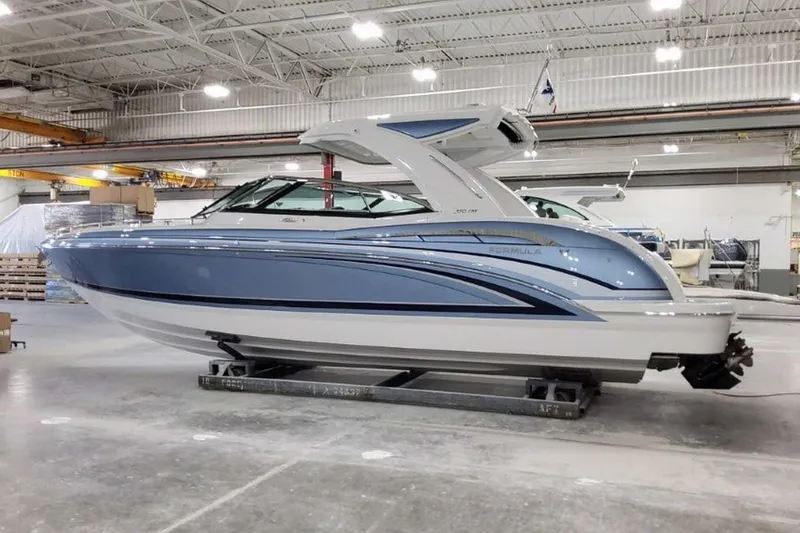 Slide: The Image of 2023 Formula 350 Crossover Bowrider I/O in a showroom, showcasing sleek design and modern features. - 3