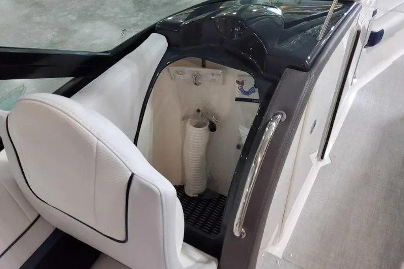 Slide: The Image of 2023 Formula 350 Crossover Bowrider I/O interior with white seating and storage compartment. - 30