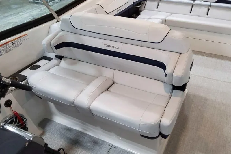Slide: The Image of 2023 Formula 350 Crossover Bowrider I/O interior with luxurious white seating. - 31