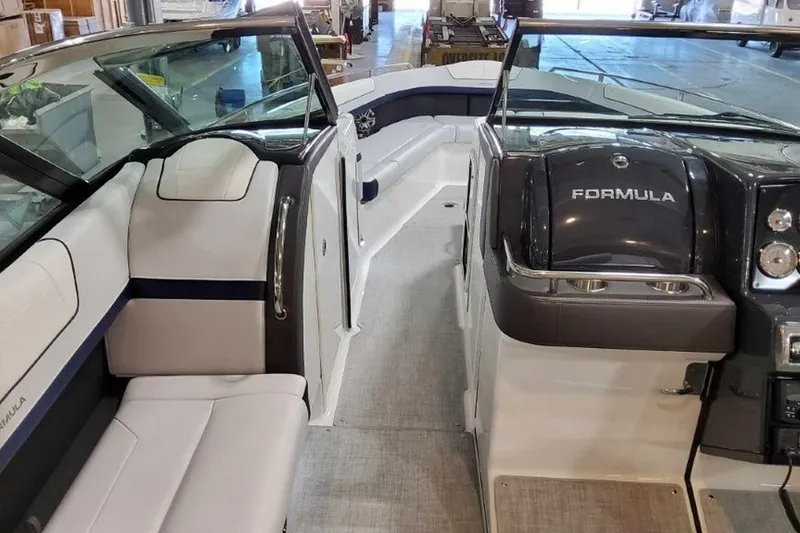 Slide: The Image of 2023 Formula 350 Crossover Bowrider I/O interior with sleek seating and modern dashboard. - 33