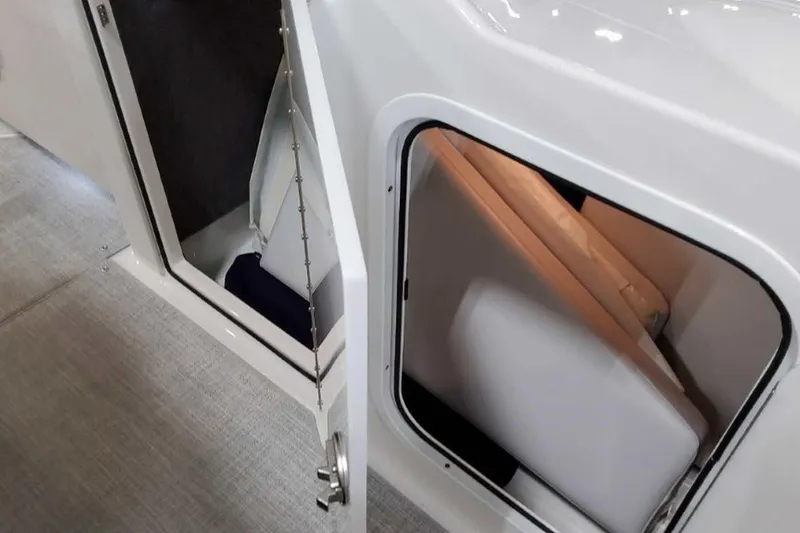 Slide: The Image of 2023 Formula 350 Crossover Bowrider I/O cabin door and interior storage view. - 34