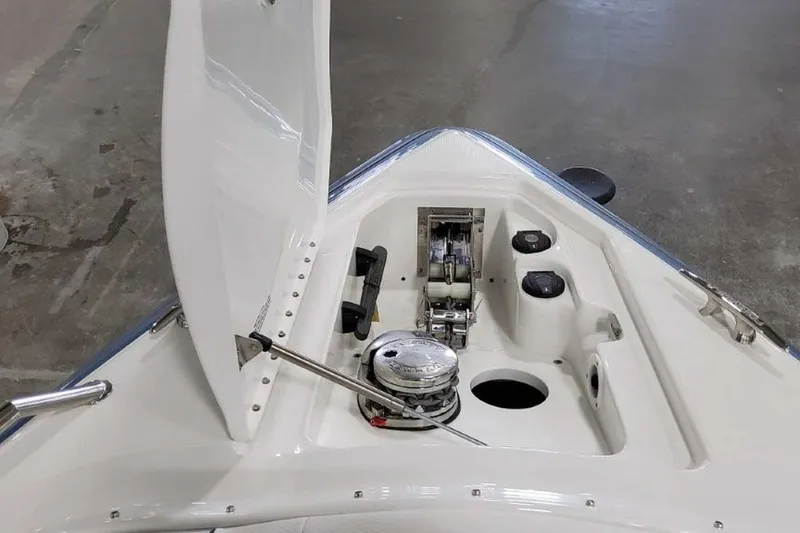 Slide: The Image of 2023 Formula 350 Crossover Bowrider I/O anchor compartment with open hatch. - 36