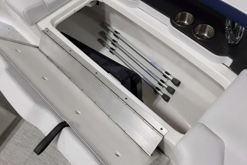 Slide: The Image of 2023 Formula 350 Crossover Bowrider I/O storage compartment with cup holders and equipment. - 39