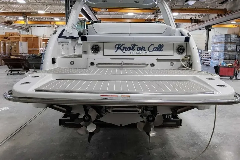 Slide: The Image of 2023 Formula 350 Crossover Bowrider I/O boat in a workshop setting. - 8