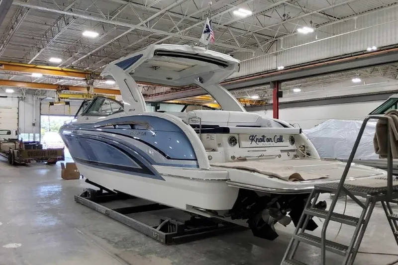 Slide: The Image of 2023 Formula 350 Crossover Bowrider I/O in a workshop. - 9