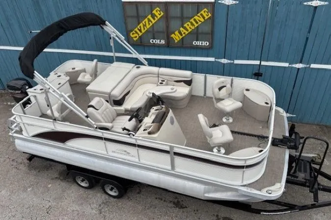 The Image of 2019 Bennington S 20 SFNP pontoon boat on trailer, displayed at Sizzle Marine, Ohio. - 0