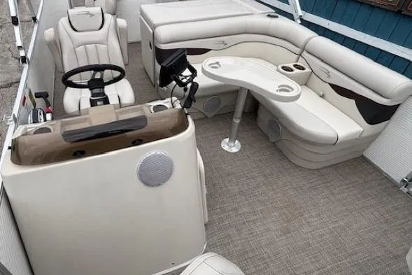 Slide: The Image of 2019 Bennington S 20 SFNP pontoon boat interior with seating and steering console. - 11
