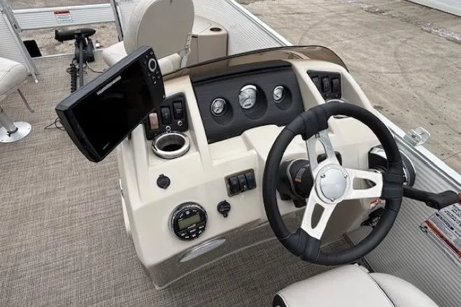 Slide: The Image of 2019 Bennington S 20 SFNP boat dashboard with steering wheel and control panel. - 15
