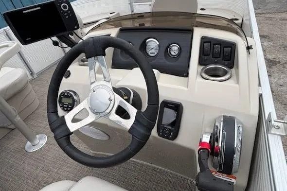 Slide: The Image of Steering console of 2019 Bennington S 20 SFNP pontoon boat with gauges and controls. - 16