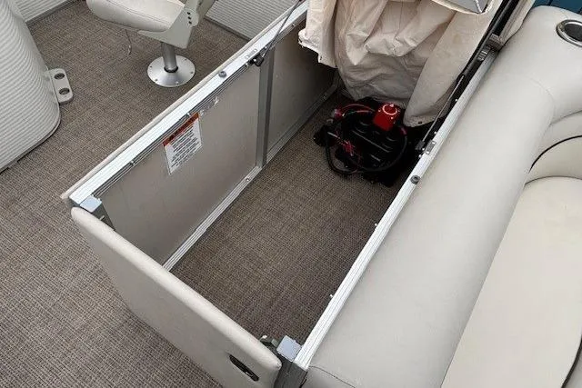 Slide: The Image of 2019 Bennington S 20 SFNP boat interior storage compartment with seating and equipment. - 21