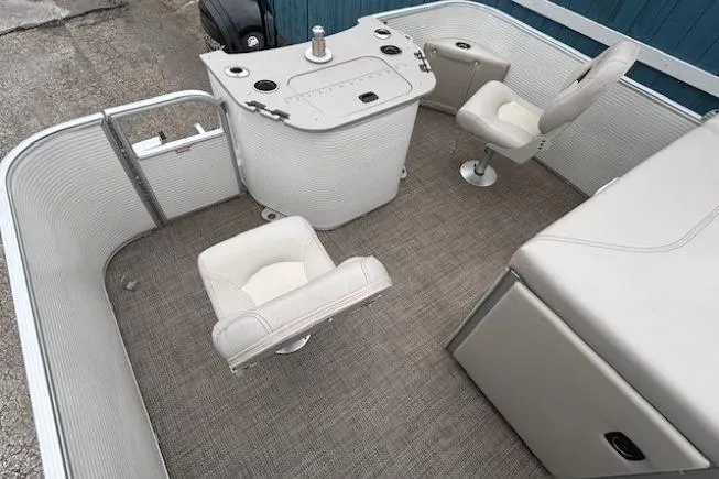Slide: The Image of 2019 Bennington S 20 SFNP pontoon boat interior with seating and control console. - 22