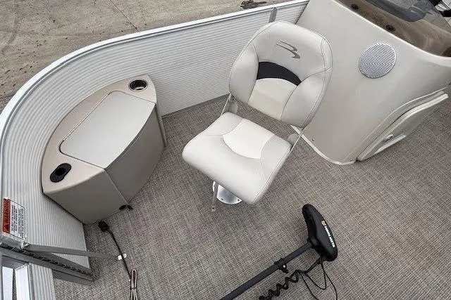 Slide: The Image of 2019 Bennington S 20 SFNP pontoon boat interior with seating and control panel. - 7
