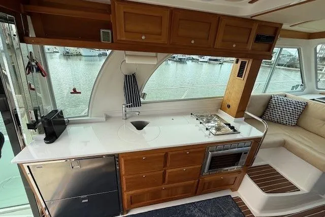 Slide: The Image of Luxurious 2019 Back Cove 41 yacht interior with modern kitchen and waterfront view. - 13