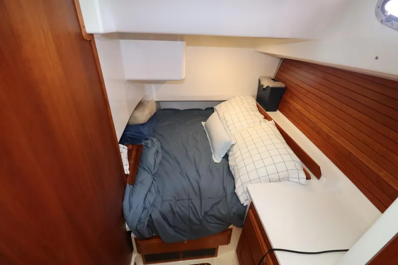 Slide: The Image of Cozy cabin interior of 2019 Back Cove 41 yacht with bed and wooden accents. - 29