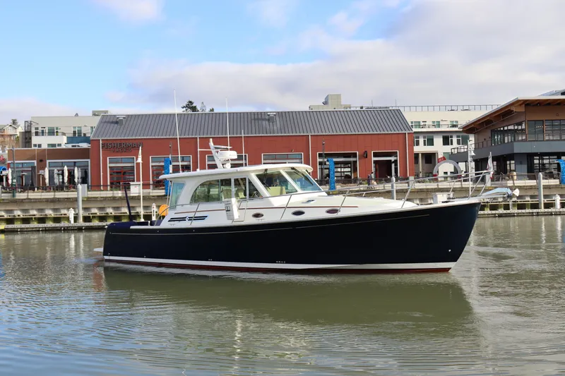 Slide: The Image of 2019 Back Cove 41 boat docked near waterfront buildings. - 3