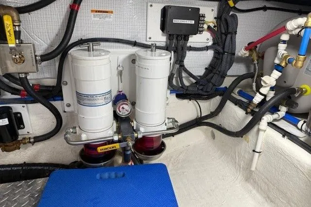 Slide: The Image of Engine room of 2019 Back Cove 41 boat with dual fuel filters and wiring. - 36
