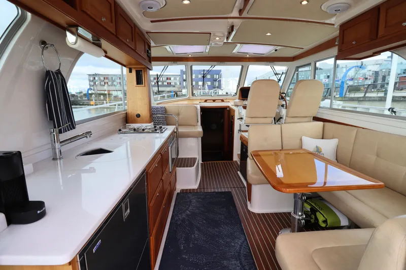 Slide: The Image of Luxurious interior of 2019 Back Cove 41 yacht with modern kitchen and seating area. - 9