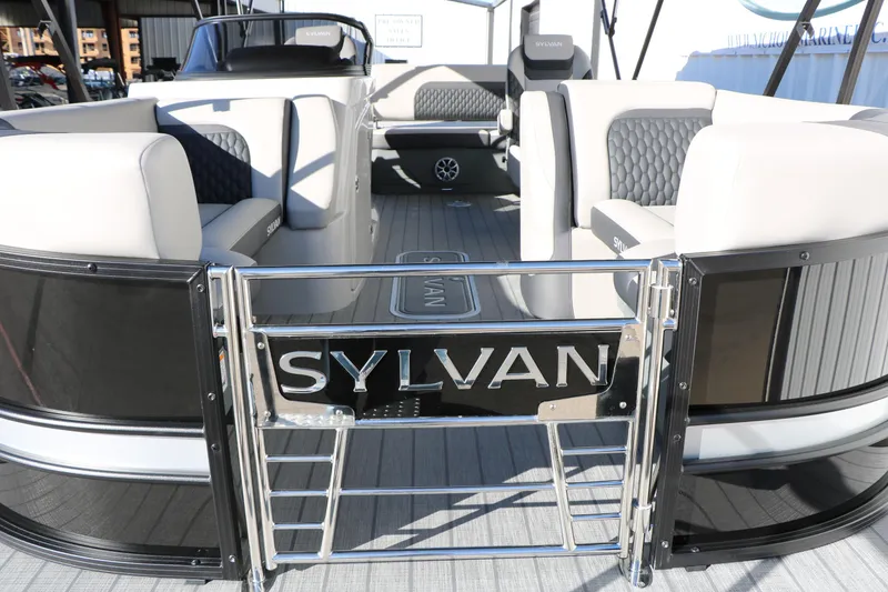 Slide: The Image of 2026 Sylvan L3 CLZ DH pontoon boat interior with stylish seating and branding. - 11