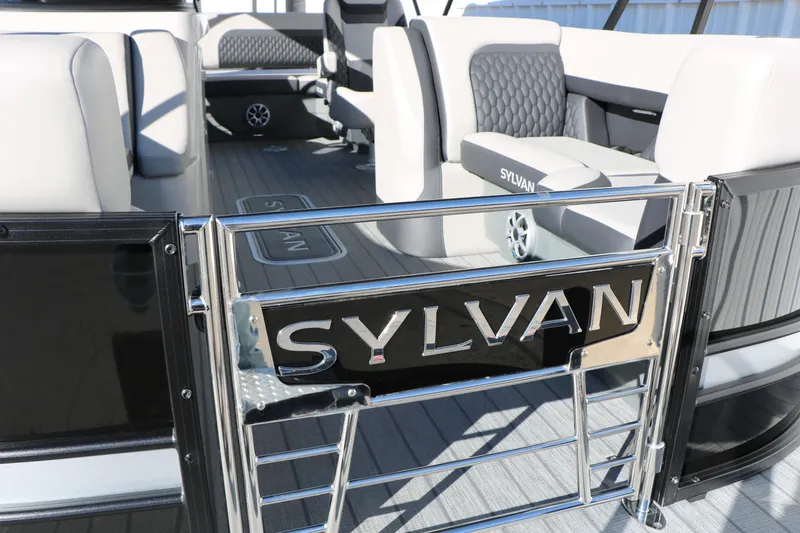 Slide: The Image of Interior of 2026 Sylvan L3 CLZ DH pontoon boat with stylish seating and branding. - 12