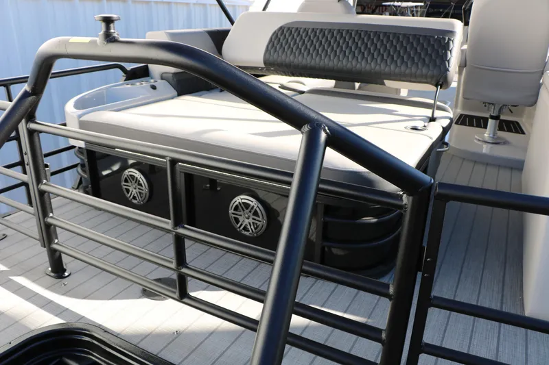 Slide: The Image of 2026 Sylvan L3 CLZ DH boat interior with cushioned seating and sleek railing design. - 19